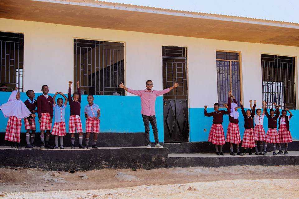 Jupe Hills pupils and a school representative outside the classrooms